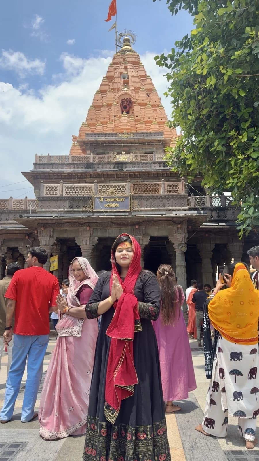 Shivangi with folded hands at Mahakaleshwar temple